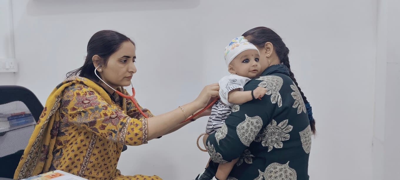 Dr. Manisha examining infant